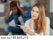 frustrated young woman with pregnancy test. Стоковое фото, агентство Ingram Publishing / Фотобанк Лори