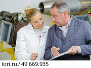 engineer with female engineer apprentice. Стоковое фото, агентство Ingram Publishing / Фотобанк Лори