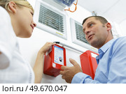 team of coworkers and fire training in office. Стоковое фото, агентство Ingram Publishing / Фотобанк Лори
