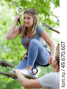 woman on the roping park. Стоковое фото, агентство Ingram Publishing / Фотобанк Лори