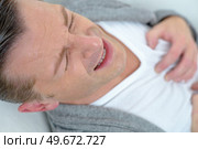 man suffering from heart ache. Стоковое фото, агентство Ingram Publishing / Фотобанк Лори
