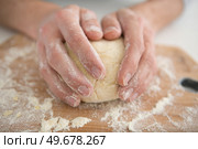 close up of female hands kneading dough at home. Стоковое фото, агентство Ingram Publishing / Фотобанк Лори