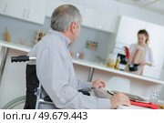 old and young men have a dinner. Стоковое фото, агентство Ingram Publishing / Фотобанк Лори