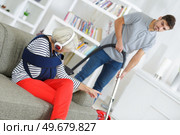 demanding employer pointing at the vacuum cleaner. Стоковое фото, агентство Ingram Publishing / Фотобанк Лори