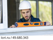 concentrated builder keeping special tool. Стоковое фото, агентство Ingram Publishing / Фотобанк Лори