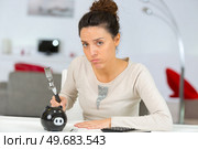 young woman thoughtful about savings. Стоковое фото, агентство Ingram Publishing / Фотобанк Лори