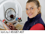 young woman in the boiler room. Стоковое фото, агентство Ingram Publishing / Фотобанк Лори