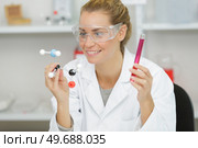female technician with pipette in lad for dna forensic testing. Стоковое фото, агентство Ingram Publishing / Фотобанк Лори