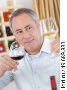 portrait of sommelier tasting red wine. Стоковое фото, агентство Ingram Publishing / Фотобанк Лори