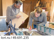 portrait of two carpenters workshop. Стоковое фото, агентство Ingram Publishing / Фотобанк Лори