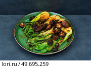 Fied pak choi or bok choy with shitake. Korean food. Fried Pak Choi and chinese mushroom. Стоковое фото, агентство Ingram Publishing / Фотобанк Лори