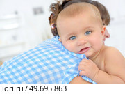 a child is looking at the camera. Стоковое фото, агентство Ingram Publishing / Фотобанк Лори