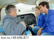 instructor teaching how to pilot a plane. Стоковое фото, агентство Ingram Publishing / Фотобанк Лори