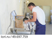 he is working in food factory. Стоковое фото, агентство Ingram Publishing / Фотобанк Лори