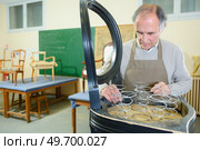 Repairing chair in a workshop. Стоковое фото, агентство Ingram Publishing / Фотобанк Лори