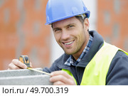 worker fixing steel rebar at building site. Стоковое фото, агентство Ingram Publishing / Фотобанк Лори