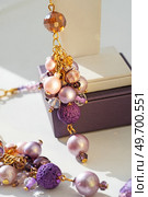trendy author  earrings with various colors pearls around white background. fashion and handmade concept. Стоковое фото, агентство Ingram Publishing / Фотобанк Лори