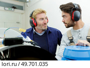 two men in workwear in a carpenters workshop. Стоковое фото, агентство Ingram Publishing / Фотобанк Лори