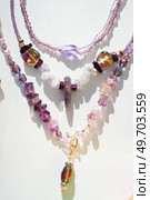 trendy author  various chokers with gemstones around white background. fashion and handmade concept. Стоковое фото, агентство Ingram Publishing / Фотобанк Лори
