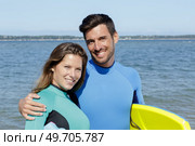 couple of young body boarders in love. Стоковое фото, агентство Ingram Publishing / Фотобанк Лори