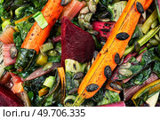 Diet food - stewed chard leaves, beets and carrots.Food background. Diet salad of stewed vegetables. Стоковое фото, агентство Ingram Publishing / Фотобанк Лори