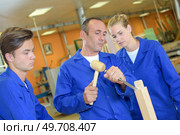 leveling the edge of a furniture. Стоковое фото, агентство Ingram Publishing / Фотобанк Лори
