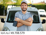 cleaner standing next to van. Стоковое фото, агентство Ingram Publishing / Фотобанк Лори