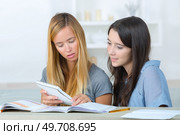 student studying in the living room at home. Стоковое фото, агентство Ingram Publishing / Фотобанк Лори