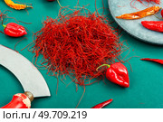 Spicy seasoning, spice, cut from red pepper. Thinly sliced pepper.. Hot red pepper spice. Стоковое фото, агентство Ingram Publishing / Фотобанк Лори
