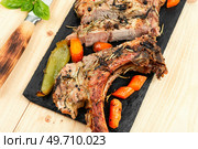 Slices of grilled steak pork. Cut grilled tomahawk meat. Roasted pork tomahawk steak. Стоковое фото, агентство Ingram Publishing / Фотобанк Лори