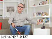 blind man at home reaching for the telephone. Стоковое фото, агентство Ingram Publishing / Фотобанк Лори