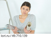 young woman unsure about repairs. Стоковое фото, агентство Ingram Publishing / Фотобанк Лори