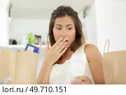 housewife looking worried at the grocery bill. Стоковое фото, агентство Ingram Publishing / Фотобанк Лори