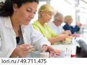 portrait of workers producing teeth prosthesis. Стоковое фото, агентство Ingram Publishing / Фотобанк Лори