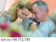 two sad people who cuddle in a cemetery. Стоковое фото, агентство Ingram Publishing / Фотобанк Лори