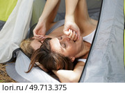 women stretching inside of tent. Стоковое фото, агентство Ingram Publishing / Фотобанк Лори