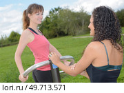 Woman twisting on park equipment. Стоковое фото, агентство Ingram Publishing / Фотобанк Лори