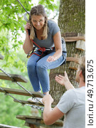 woman on the roping park. Стоковое фото, агентство Ingram Publishing / Фотобанк Лори