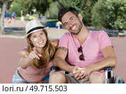 woman and disabled man in the park. Стоковое фото, агентство Ingram Publishing / Фотобанк Лори