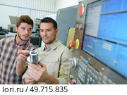 apprentice mechanical technician with mentor. Стоковое фото, агентство Ingram Publishing / Фотобанк Лори