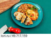 Baked clams, squid stuffed with rice and nettle.. Sliced baked squid stuffed with rice. Стоковое фото, агентство Ingram Publishing / Фотобанк Лори
