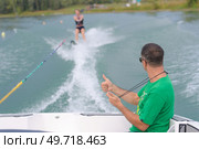a girl riding on wakeboarding. Стоковое фото, агентство Ingram Publishing / Фотобанк Лори