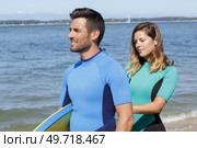 young couple of bodyboard surfers. Стоковое фото, агентство Ingram Publishing / Фотобанк Лори