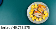 Appetizing meat roasted with fresh pineapple. Cuban food. Flat lay with copy space.. Pork meat fried with pineapple, space for text. Стоковое фото, агентство Ingram Publishing / Фотобанк Лори