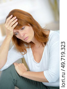 a depressed woman at home. Стоковое фото, агентство Ingram Publishing / Фотобанк Лори