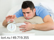 young man does not want to wake up. Стоковое фото, агентство Ingram Publishing / Фотобанк Лори
