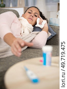 sick woman cup of tea pills and mixture. Стоковое фото, агентство Ingram Publishing / Фотобанк Лори