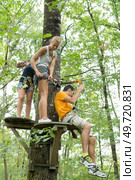 woman having fun in an outdoor adventure park. Стоковое фото, агентство Ingram Publishing / Фотобанк Лори