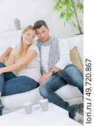 Young couple relaxing at home. Стоковое фото, агентство Ingram Publishing / Фотобанк Лори