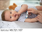 baby sick with measuring electric thermometer. Стоковое фото, агентство Ingram Publishing / Фотобанк Лори